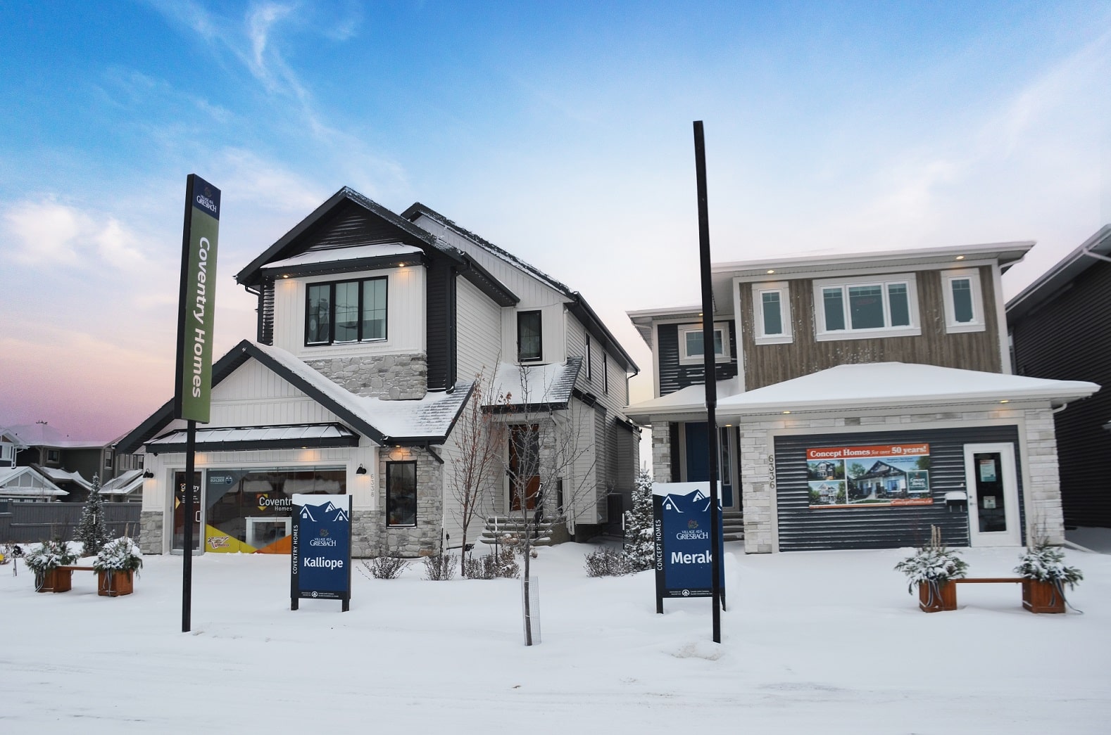 Two attached garage show homes on a snowy, winter day. Signage indicates Coventry Homes’ Kalliope model and Concept Homes’ Meraki model.
